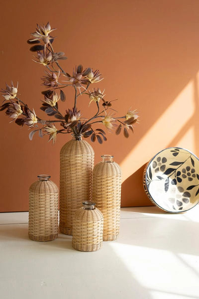 1 SET OF FOUR RATTAN WRAPPED GLASS VASES