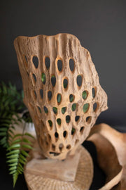 CARVED TEAK WOOD SCUPLTURE ON A BASE - PERFORATED