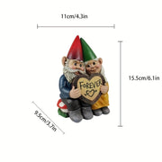 Garden gnome couple statue holding a heart that says forever, perfect for garden decoration.