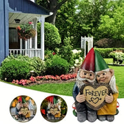 Garden gnome couple statue holding a heart that says Forever, perfect for garden decor.