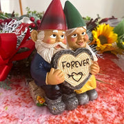 Garden gnome couple statue holding a heart sign saying 'FOREVER', perfect for garden decor.